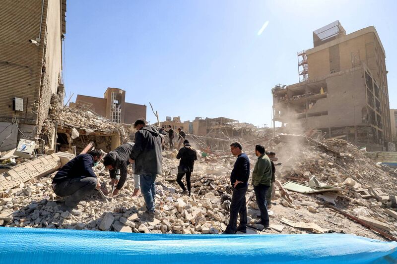People inspect the rubble of a collapsed building near Ferdowsi square in Tehran on March 3, 2026. Picture: ATTA KENARE / AFP via Getty Images