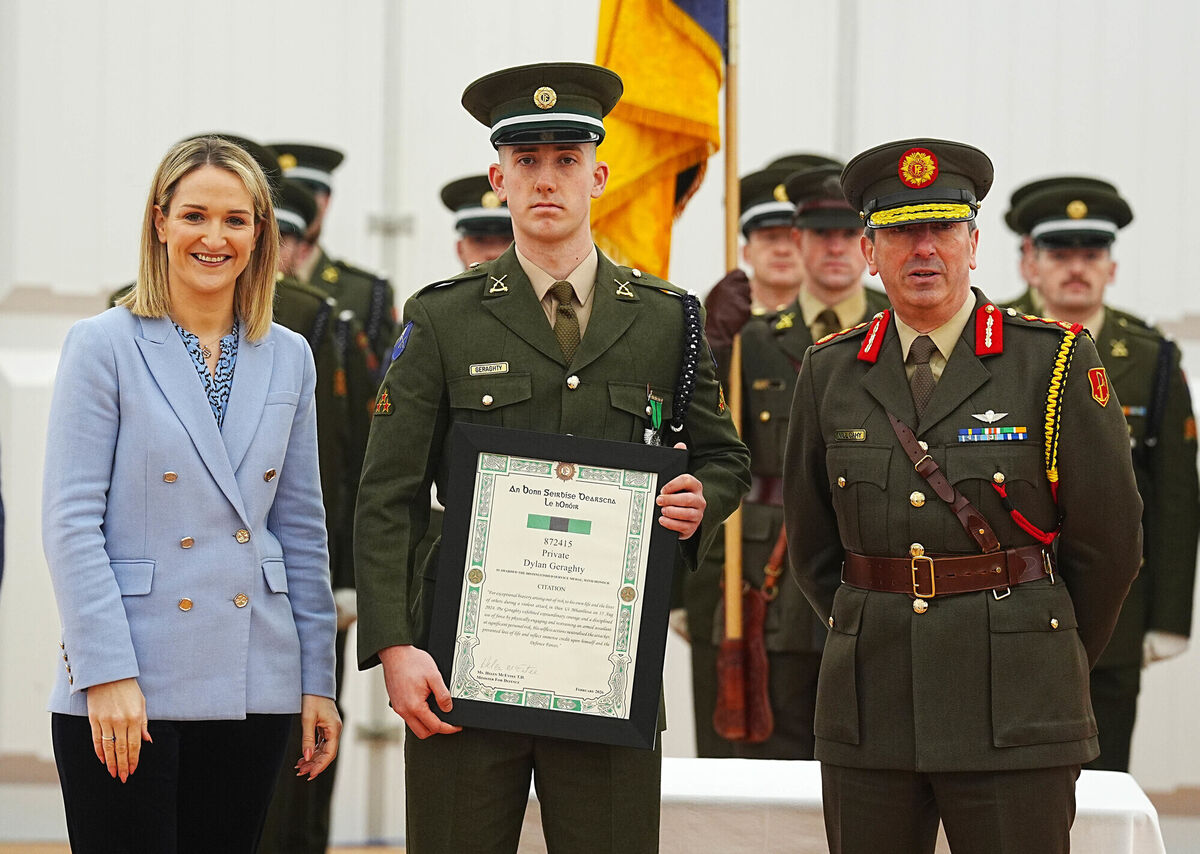 Defence minister Helen McEntee and chief of staff Lt Gen Rossa Mulcahy with Private Dylan Geraghty. Picture: Brian Lawless/PA