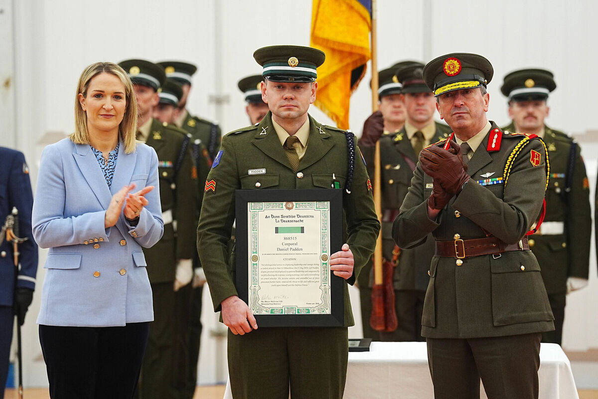 Defence minister Helen McEntee and chief of staff Lt Gen Rossa Mulcahy with Corporal Daniel Padden. Picture: Brian Lawless/PA