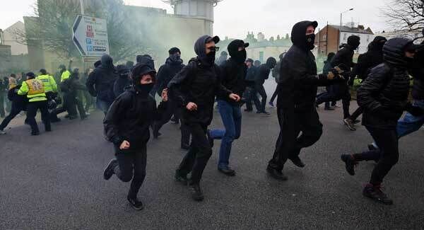 Anti-fascist protesters break through police lines. Pic: PA Anti-fascist protesters break through police lines. Pic: PA