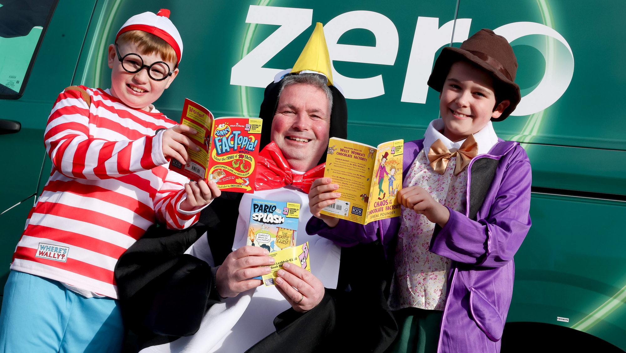 Postman Paul Fitzpatrick with his helpers Joe Elliott and Tadgh Cannon as An Post aims to deliver over 40,000 books to children in hospitals, care settings, and direct provision centres across the country for World Book Day. Picture: Maxwells