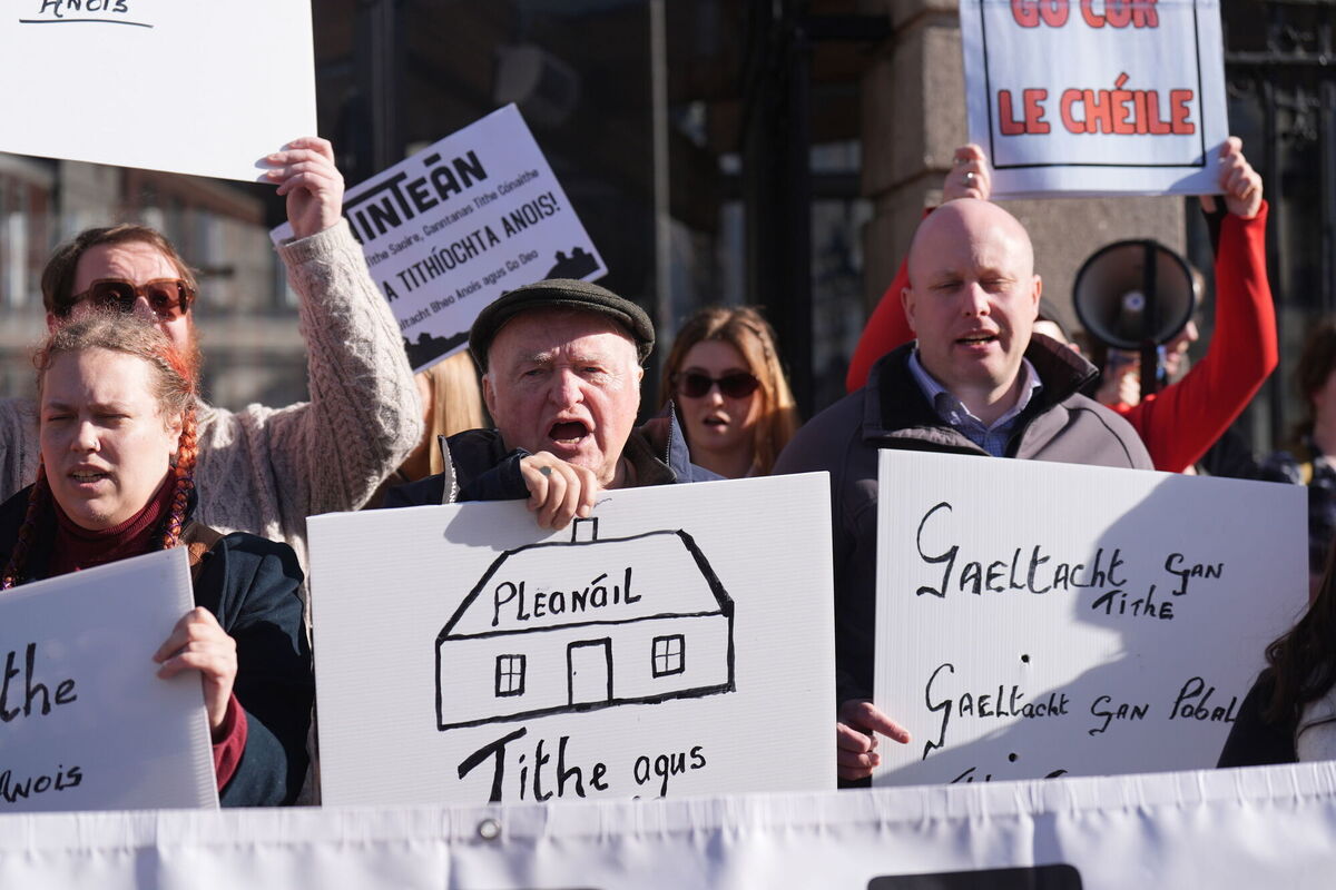Members of the national Gaeltacht housing campaign group Tinteán during a protest outside Leinster House. Picture: Niall Carson/PA