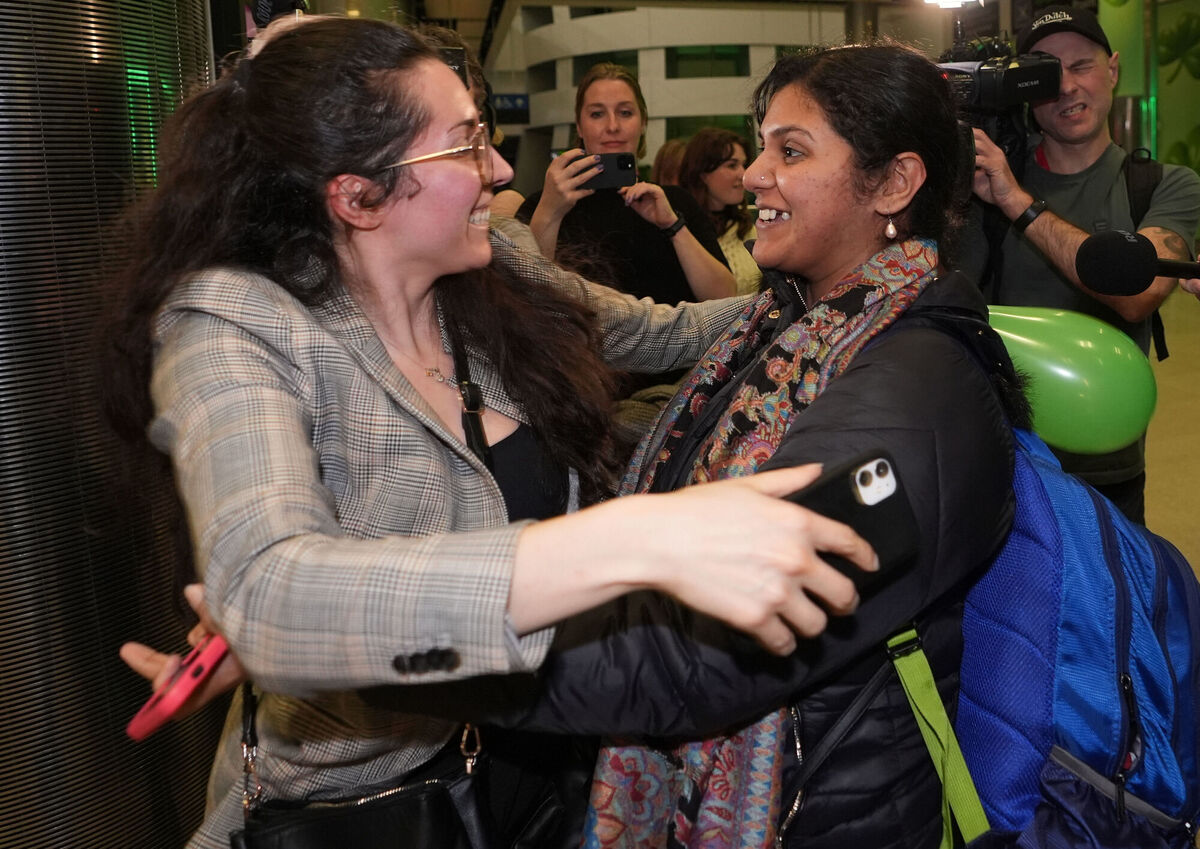 Upama Ghosh (right) from India is met by her friends as she arrives at Dublin Airport. Picture: Niall Carson/PA Wire