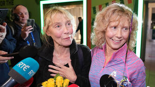 <p>Norita Geary (left) is welcomed by her sister Elaine Gleeson, from Limerick, as she arrives at Dublin Airport on a flight from Dubai in the United Arab Emirates. Picture: Niall Carson/PA Wire</p>