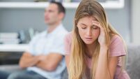 Couple not speaking after an argument on the couch