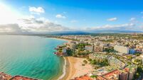 Beach and cityscape Salou, Spain, Europe. Tourist city on Costa Dorada
