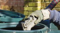 Man filling oil tank with domestic heating kerosene. England, UK
