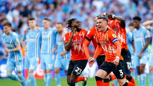 <p>LUCRATIVE: Luton Town's Dan Potts (right) celebrates after his team win the penalty shoot-out of the Sky Bet Championship play-off final at Wembley Stadium in 2023. Picture: PA</p>