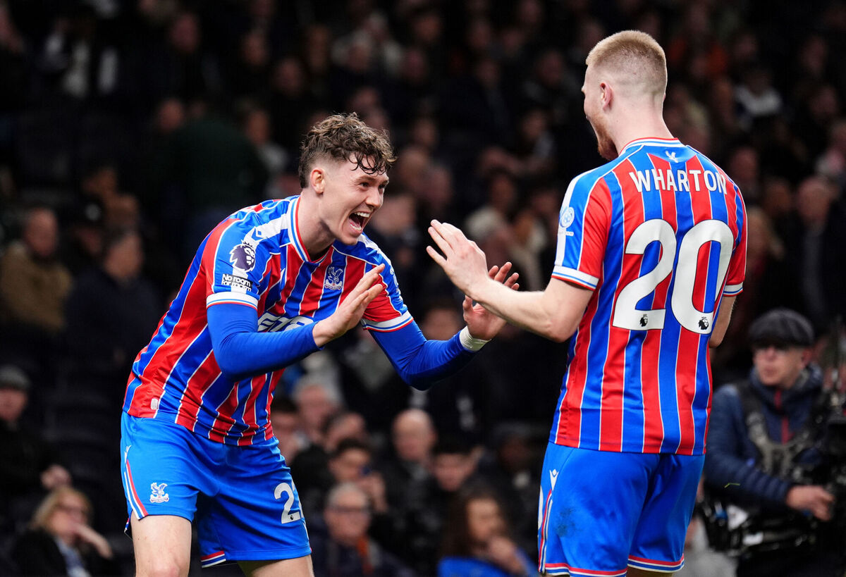Crystal Palace's Jorgen Strand Larsen celebrates with team-mate Adam Wharton after scoring the second. Pic: John Walton/PA