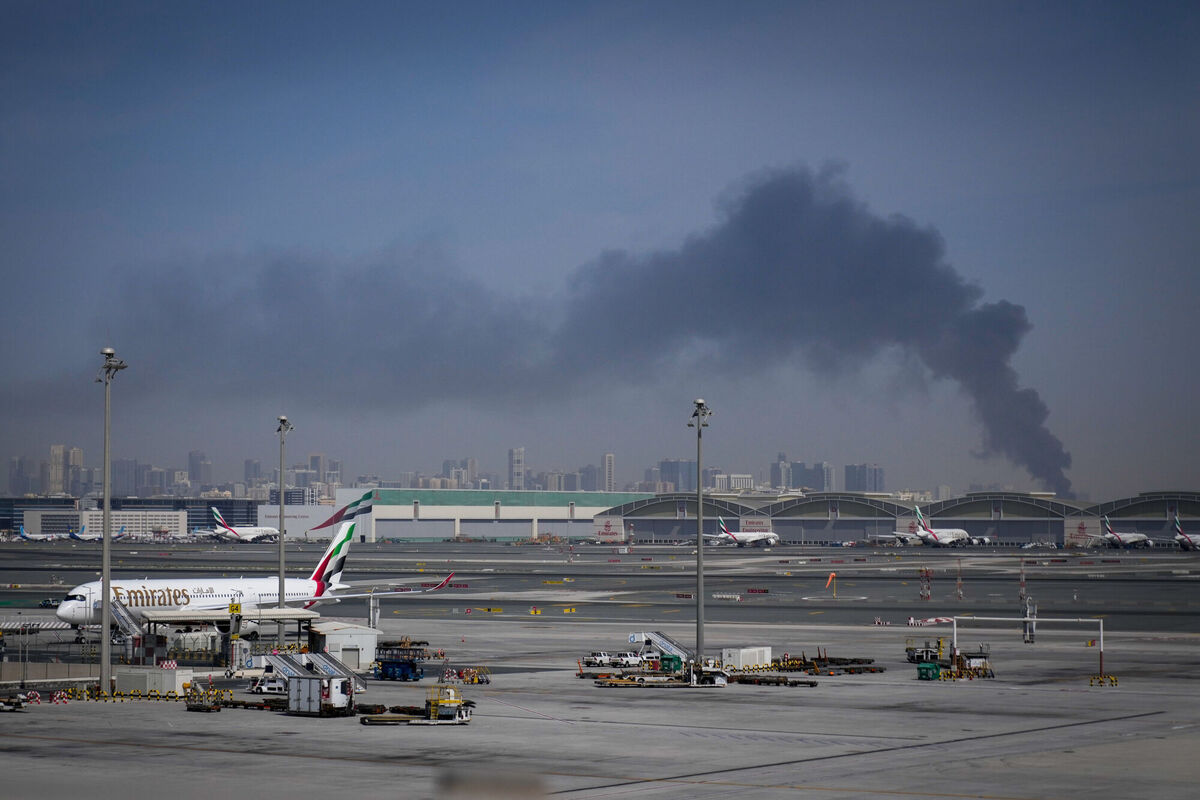 Emirates airplanes are parked at the Dubai International Airport after its closure in Dubai, United Arab Emirates, Sunday, March 1, 2026. (AP Photo/Altaf Qadri)