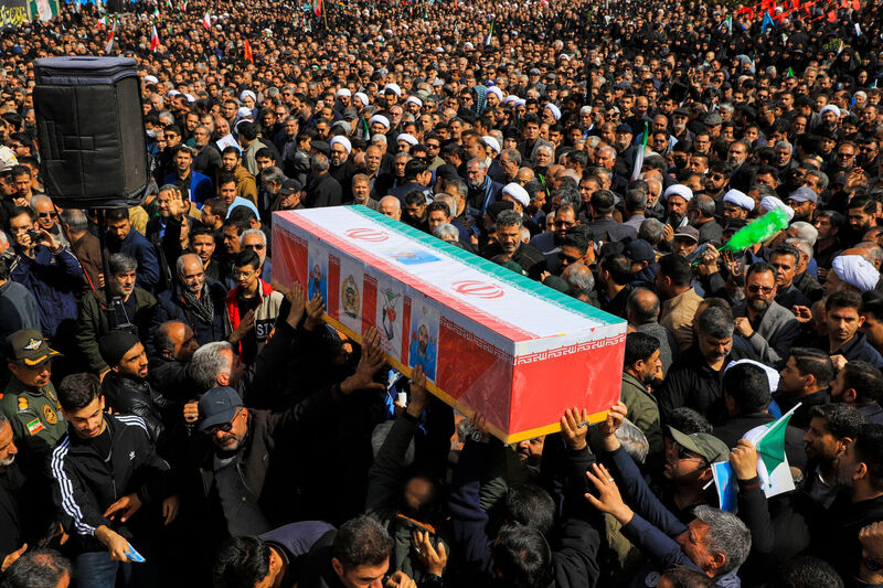 A coffin is carried during a funeral for people killed during the ongoing U.S.???Israeli military campaign in Kerman, Iran, Thursday, March 5, 2026. (Sare Tajalli/ISNA via AP)