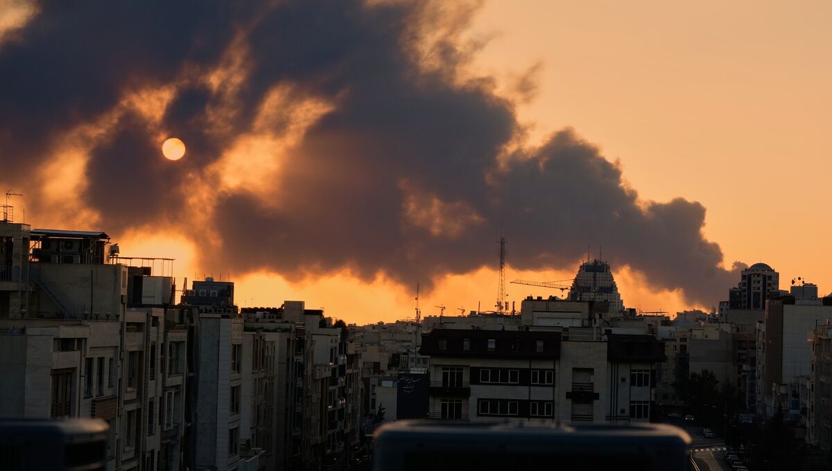 A plume of smoke rises following a US-Israeli military strike in Tehran, Iran, on Tuesday. Picture: Vahid Salemi/AP