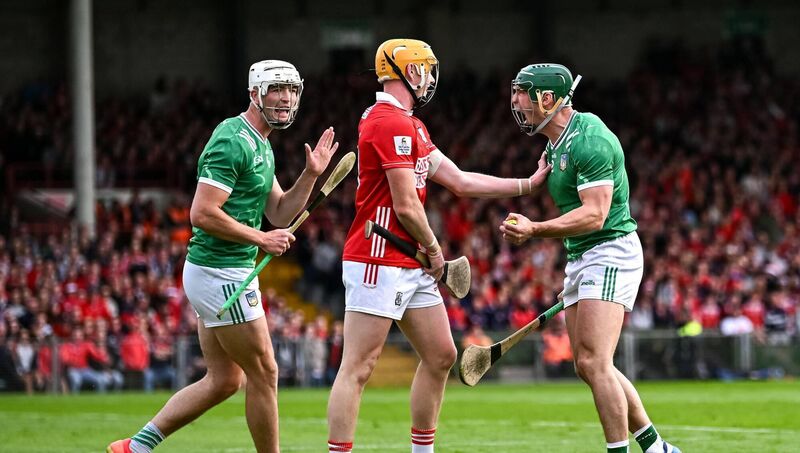 Limerick players Seán Finn, right, and Kyle Hayes celebrate winning a free against Shane Barrett of Cork last season. Pic: Piaras Ó Mídheach/Sportsfile