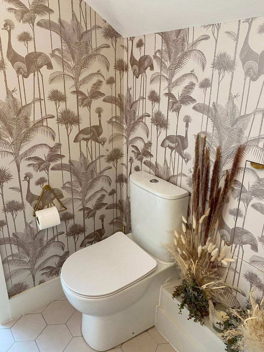 Wallpaper can be a great temporary fix; check to make sure it's breathable if you're putting it on old walls.