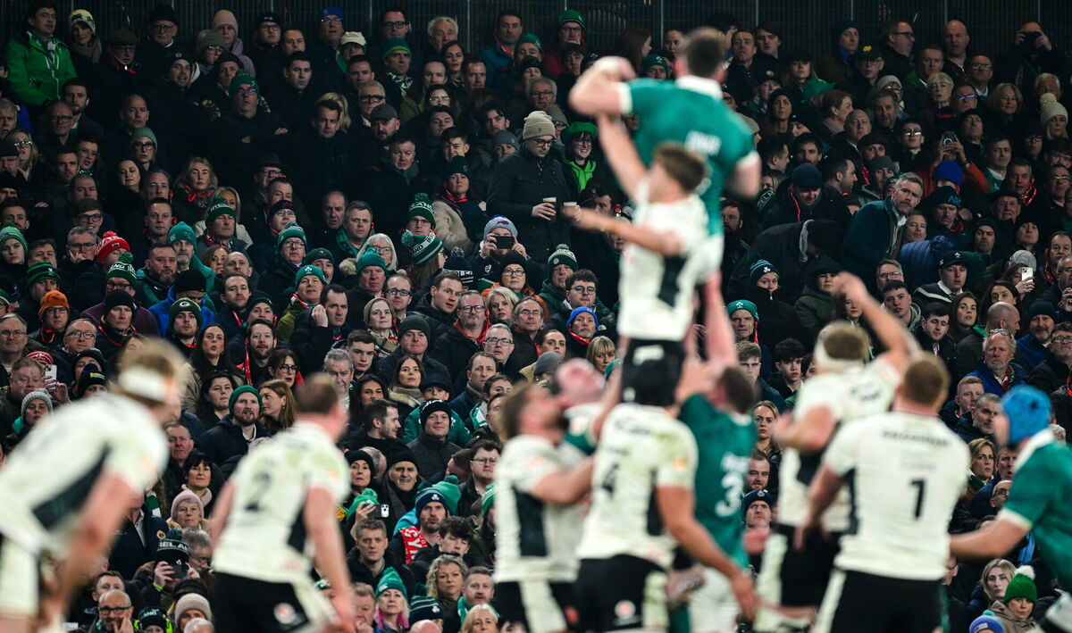 Spectators look on during a line-out. Ramsey Cardy/Sportsfile