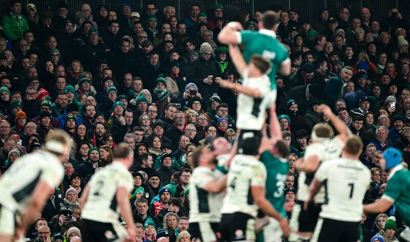 Spectators look on during a line-out. Ramsey Cardy/Sportsfile