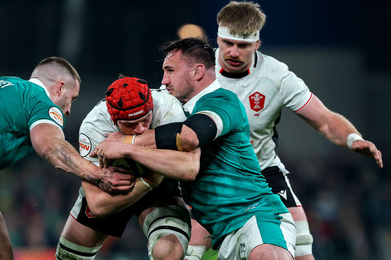 Wales' Dafydd Jenkins is tackled by Ireland's Ronan Kelleher. Pic: Ben Brady/Inpho