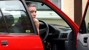 <p>Ian Huntley sitting in his car outside his house (Andrew Parsons/PA)</p>