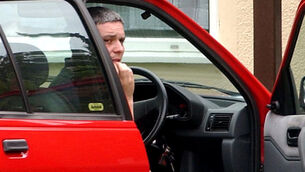 <p>Ian Huntley sitting in his car outside his house (Andrew Parsons/PA)</p>