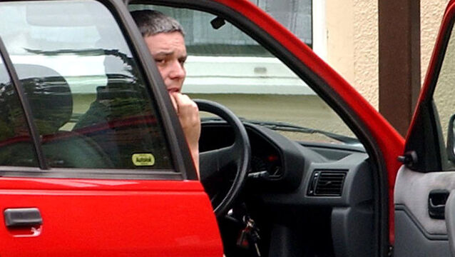 <p>Ian Huntley sitting in his car outside his house (Andrew Parsons/PA)</p>