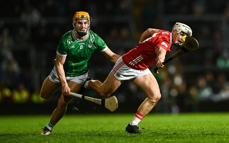 ON THE CHARGE: Tommy O’Connell of Cork is tackled by Adam English of Limerick. Photo by Tom Beary/Sportsfile