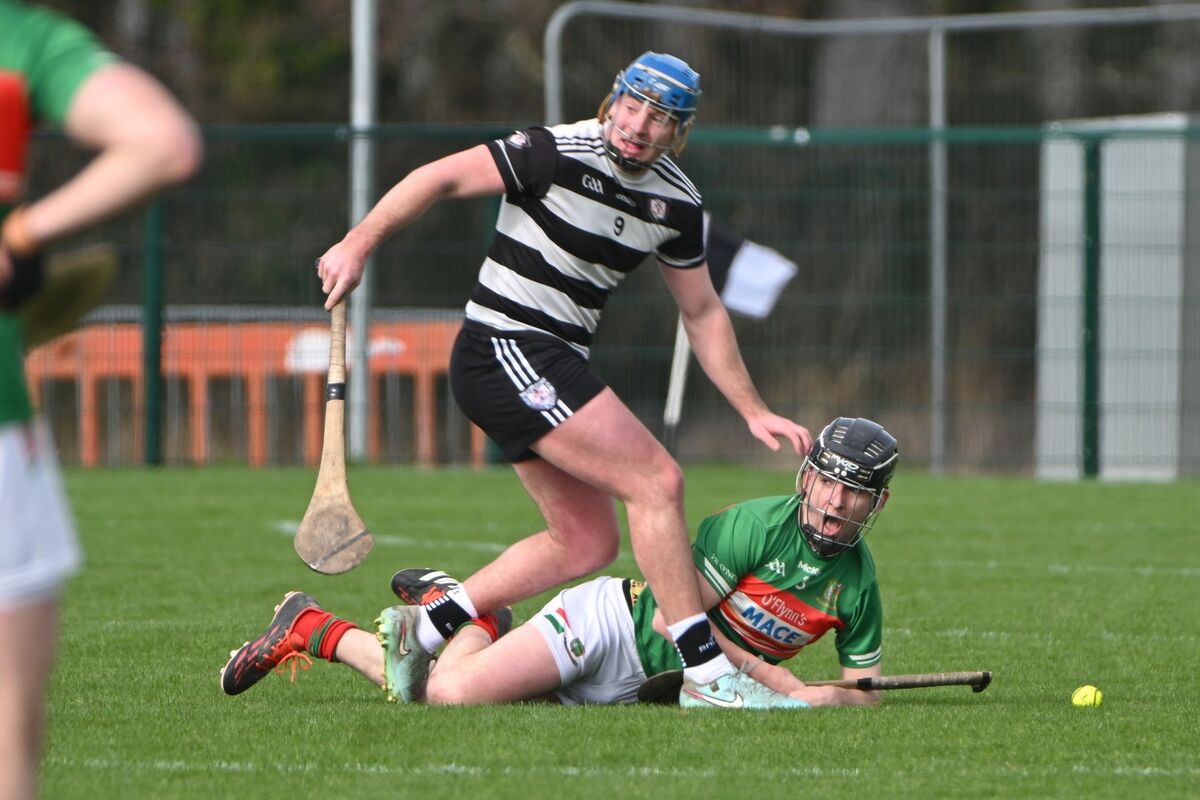 Midleton’s Killian McDermott puts in a tackle on Fr O’Neill’s Olan Steele during their Cork SHL meeting. Midleton won the game by six points. Pic: Chani Anderson