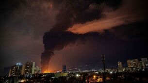 <p>Flames and smoke rise from an oil storage facility in Tehran, Iran (Alireza Sotakbar/ISNA via AP)</p>