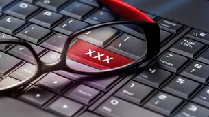 Adult content button through reading glasses.