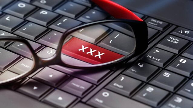 Adult content button through reading glasses.