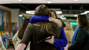 <p>Passengers are welcomed by family members as they arrive at Dublin Airport following an Irish Government chartered flight from Oman, which stopped at Cairo, before touching down in Dublin in the early hours of Sunday. </p>
