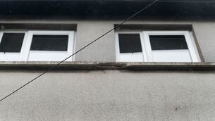 <p>Concrete crumbled off this windowsill on a property in Cork City Council's portfolio. Picture: Noel</p>