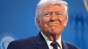 <p>Donald Trump smiles before speaking at the Republican Members Issues Conference on Monday. Picture: AP</p>