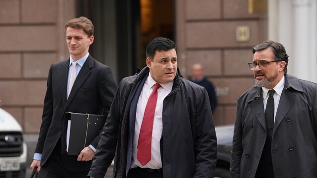Jonathan Ganesh, centre, gave evidence in the court case (Gareth Fuller/PA)