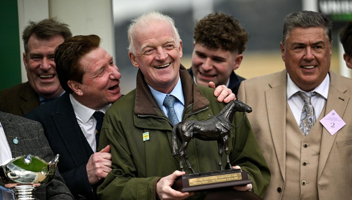 Trainer Willie Mullins celebrates with the trophy after sending out Kargese to win the Singer Arkle Challenge Trophy Novices' Chase. Pic: Harry Murphy/Sportsfile.