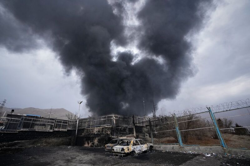 An oil storage facility in Tehran, Iran, is hit by a US-Israeli strike on Sunday. Higher energy prices often lead to rising food and living costs, which disproportionately affect women and families already struggling with poverty, debt and climate shocks. Photo: AP/Vahid Salemi