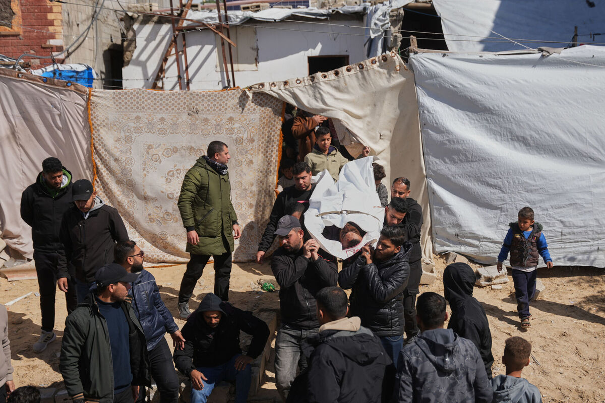 Mourners carry the body of a Palestinian policeman who was killed in an Israeli military strike in Khan Younis, southern Gaza Strip last month. Photo: AP/Abdel Kareem Hana