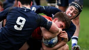 <p>CLOSE QUARTERS: St Muredach's Oisin Breslin is held up by Sligo Grammar's Andrew Ryan and Matthew O'Grady. Pic: INPHO/Tom O’Hanlon</p>
