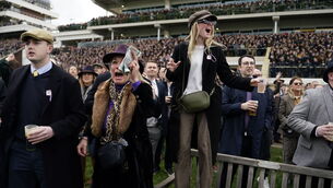 <p class="contextmenu internal_Caption">Racegoers react during the Singer Arkle Novices’ Chase on day one of this year's Cheltenham Festival at Cheltenham Racecourse. Picture: Andrew Matthews/PA</p>