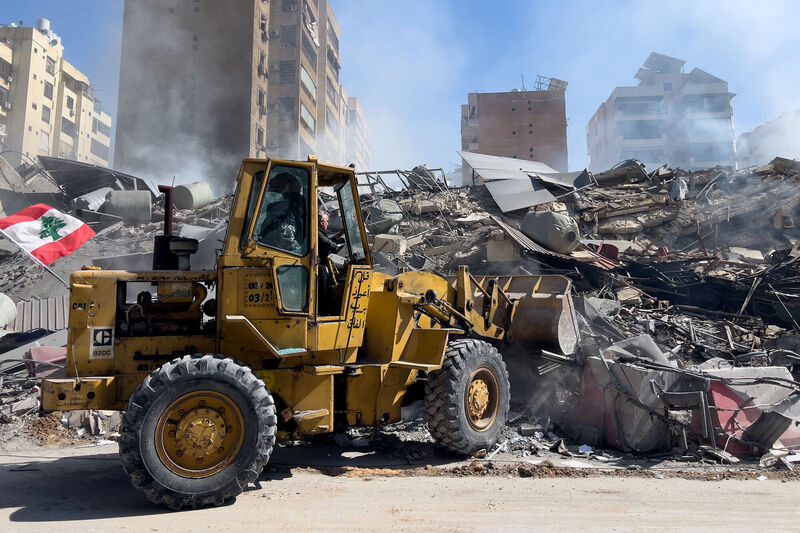 A bulldozer removes the wreckage of a destroyed building that was hit by an Israeli airstrike in Dahiyeh, Beirut's southern suburbs, Lebanon, on  Tuesday. Picture: Hussein Malla/AP