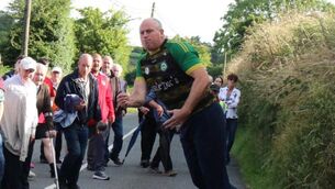 <p>Road bowling: Gary Daly in action. Pic: Gretta Cormican</p>