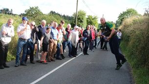 <p>Road bowling: Gary Daly in action. Pic: Gretta Cormican</p>