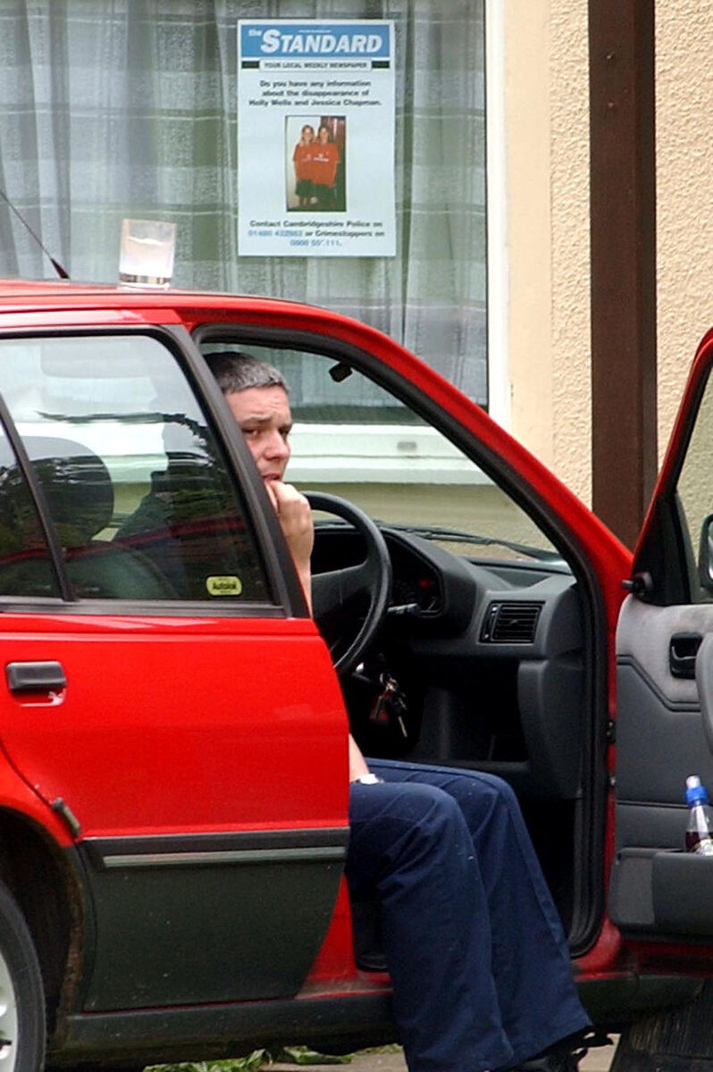 Ian Huntley sitting in his car outside his house near the college in Soham in 2002 when police were looking for 10-year-old Holly Wells and Jessica Chapman. File picture Ian Huntley sitting in his car outside his house near the college in Soham in 2002 when police were looking for 10-year-old Holly Wells and Jessica Chapman. File picture