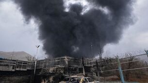 <p>A thick plume of smoke rises from an oil storage facility hit by a US-Israeli strike in Tehran, Iran. Picture: Vahid Salemi/AP Photo.</p>