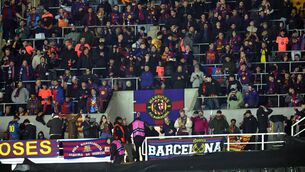 <p>ONE MISSING: Barcelona fans in the away stand ahead of the UEFA Champions League round of sixteen, first leg match at St James' Park, Newcastle. Pic: Steve Welsh/PA Wire.</p>