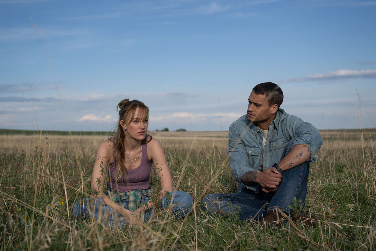 Maika Monroe as Kenna Rowan and Tyriq Withers as Ledger Ward in Reminders of Him
