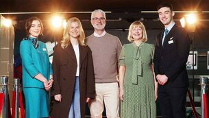 <p>Aer Lingus crew members Shane Lynch and Megan Fuller welcomed the family of Best Actress nominee, Jessie Buckley, to Dublin Airport as they boarded Aer Lingus flight bound for Los Angeles.Picture: Leon Farrell / Photocall Ireland</p>
